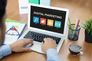 Laptop displaying digital marketing concepts highlighting the scope of digital marketing including SEO, content creation, research, and online branding.